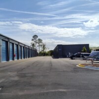 Outside drive-up storage units on the left and to the right shows outdoor vehicle parking with RVs, Boats, Cars, and Trucks present